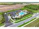 Aerial view of community pool, dog park, parking and playground; landscaping and construction underway at 17206 Luminous Ave, Venice, FL 34293