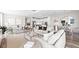Open-concept living room flows into a modern kitchen with stainless steel appliances and a cozy dining area at 17206 Luminous Ave, Venice, FL 34293