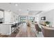 Bright, open-concept living space with a modern kitchen, dining area, and comfortable seating at 17206 Luminous Ave, Venice, FL 34293