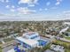 Wide angle view of the SARC building with a pool, parking lot, and the Gulf in the background at 1735 Maryland Ne Ave, St Petersburg, FL 33703