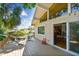 Back deck with a hammock, seating area, decorative lights, sliding glass doors and views of the yard at 1735 Maryland Ne Ave, St Petersburg, FL 33703