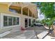 Wooden back deck featuring a hammock, seating area, decorative lighting, sliding glass doors and plants at 1735 Maryland Ne Ave, St Petersburg, FL 33703
