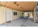 Charming back patio with outdoor seating and exterior door, creating a cozy outdoor living area at 1735 Maryland Ne Ave, St Petersburg, FL 33703