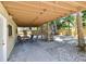 Spacious back patio with wooden stairs to the yard, offering a versatile outdoor entertainment space at 1735 Maryland Ne Ave, St Petersburg, FL 33703