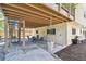 Back patio offering a shaded outdoor space with seating, ideal for relaxation and entertaining at 1735 Maryland Ne Ave, St Petersburg, FL 33703