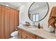 Stylish bathroom with a granite vanity, modern fixtures, and a warm and inviting ambiance at 1735 Maryland Ne Ave, St Petersburg, FL 33703