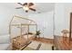 Cozy bedroom with a unique wooden bed frame, stylish rug, and lots of natural light at 1735 Maryland Ne Ave, St Petersburg, FL 33703