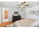 Comfortable bedroom with hardwood floors, stylish decor, and an ensuite bathroom at 1735 Maryland Ne Ave, St Petersburg, FL 33703