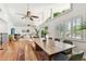 Open-concept dining area with a wooden table, comfortable seating, and views of the spacious living room at 1735 Maryland Ne Ave, St Petersburg, FL 33703