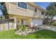Inviting home exterior showcasing a manicured front yard and a two-car attached garage at 1735 Maryland Ne Ave, St Petersburg, FL 33703