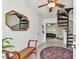 Bright and airy foyer with a spiral staircase, mirrored wall decor, and a bench seat at 1735 Maryland Ne Ave, St Petersburg, FL 33703