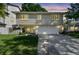Charming two-story home featuring a two-car garage and a cozy front porch at 1735 Maryland Ne Ave, St Petersburg, FL 33703