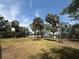 Community grounds featuring green grass, palm trees, benches, and water in the background at 1735 Maryland Ne Ave, St Petersburg, FL 33703