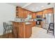 Spacious kitchen boasts wood cabinets, stainless appliances, and a tile backsplash at 1735 Maryland Ne Ave, St Petersburg, FL 33703