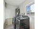 A practical laundry room features modern washer and dryer, and a window for natural light at 1735 Maryland Ne Ave, St Petersburg, FL 33703
