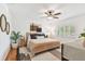 Stylishly decorated main bedroom featuring modern decor, light wood furnishings, and a ceiling fan at 1735 Maryland Ne Ave, St Petersburg, FL 33703