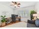 Bright home office features a wooden desk, modern computer, comfortable chair, and a large window for natural light at 1735 Maryland Ne Ave, St Petersburg, FL 33703