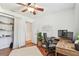 Bright office features wood floors, desk, chair, closet, and neutral walls at 1735 Maryland Ne Ave, St Petersburg, FL 33703
