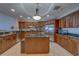 The gourmet kitchen offers custom cabinets, an island, and modern stainless steel appliances at 17735 Gulf Blvd # 202, Redington Shores, FL 33708
