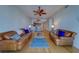 An open-concept living space boasts hardwood floors, a dining area, and views into the gourmet kitchen at 17735 Gulf Blvd # 202, Redington Shores, FL 33708