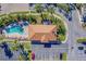 Inviting community pool and jacuzzi area perfect for relaxation and recreation, surrounded by lush greenery at 17735 Gulf Blvd # 202, Redington Shores, FL 33708