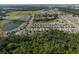 Expansive aerial view showcasing the community layout with ponds and lush green spaces at 1823 Moon Cactus Ct, Ruskin, FL 33570
