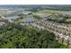 Community aerial view showcasing the neighborhood layout with ponds and lush green spaces at 1823 Moon Cactus Ct, Ruskin, FL 33570