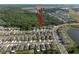 Aerial view of a neighborhood near a lush landscape, showcasing the community layout and nearby green spaces at 1823 Moon Cactus Ct, Ruskin, FL 33570