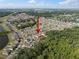 Community aerial view highlighting many single Gathering homes and landscaping near lakes and forested areas at 1823 Moon Cactus Ct, Ruskin, FL 33570
