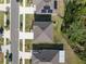 Aerial view of a well maintained roof with surrounding manicured lawn and residential neighborhood at 1823 Moon Cactus Ct, Ruskin, FL 33570