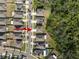 Aerial view highlighting single Gathering homes, landscaping, nearby streets and adjacent tree preserve at 1823 Moon Cactus Ct, Ruskin, FL 33570