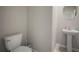 Bathroom features a toilet and sink at 1823 Moon Cactus Ct, Ruskin, FL 33570