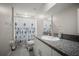 Bathroom featuring a granite countertop, single sink, and shower with curtain at 1823 Moon Cactus Ct, Ruskin, FL 33570