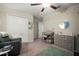 Well-organized Bedroom with a changing table, dresser, closet, and a comfortable chair for relaxation at 1823 Moon Cactus Ct, Ruskin, FL 33570