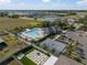 Aerial view showcasing the community pool, clubhouse, and recreation areas for residents at 1823 Moon Cactus Ct, Ruskin, FL 33570