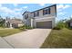 Charming two-story home featuring a well-maintained lawn and a two-car garage at 1823 Moon Cactus Ct, Ruskin, FL 33570