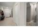 Hallway with neutral paint and ceramic tile flooring at 1823 Moon Cactus Ct, Ruskin, FL 33570