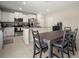 Spacious kitchen and dining area with an island, stainless appliances and granite countertops at 1823 Moon Cactus Ct, Ruskin, FL 33570
