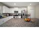 Modern kitchen with granite countertops, stainless steel appliances, and ample cabinet space for storage at 1823 Moon Cactus Ct, Ruskin, FL 33570