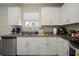 Bright kitchen featuring stainless steel appliances, granite countertops and ample cabinet space at 1823 Moon Cactus Ct, Ruskin, FL 33570