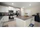 Spacious kitchen island featuring granite countertops and stainless steel appliances, perfect for Gathering gatherings at 1823 Moon Cactus Ct, Ruskin, FL 33570