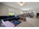 Spacious living room area with playful area in the background and tile flooring at 1823 Moon Cactus Ct, Ruskin, FL 33570