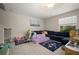 Comfortable living room with a large sofa and play area, perfect for Gathering time at 1823 Moon Cactus Ct, Ruskin, FL 33570