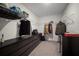Walk in closet with custom shelves and dresser in neutral tones at 1823 Moon Cactus Ct, Ruskin, FL 33570