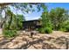 Inviting backyard featuring a fire pit and comfortable seating, ideal for relaxation and entertainment at 18816 Carr Dr, Lutz, FL 33559