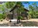 Stunning exterior featuring a modern design, balcony, and well-maintained yard at 18816 Carr Dr, Lutz, FL 33559