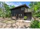 Exterior elevation of a well-maintained home with charming balcony and natural landscaping at 18816 Carr Dr, Lutz, FL 33559
