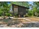 Striking modern home with a distinctive exterior design and lush landscaping at 18816 Carr Dr, Lutz, FL 33559