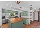 Charming kitchen boasting wood countertops, stainless steel appliances and green cabinets at 18816 Carr Dr, Lutz, FL 33559