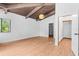 Spacious main bedroom with a peaked, wood-paneled ceiling, bright lighting and wood floors at 18816 Carr Dr, Lutz, FL 33559
